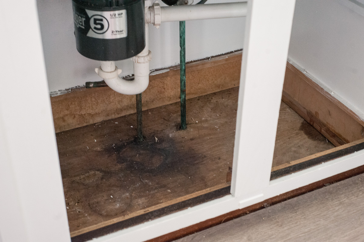 bathroom sink cabinet water damage