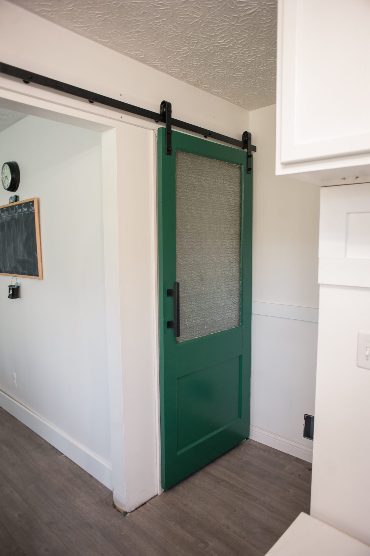How to turn a vintage door into a barn door. Our Bright Road