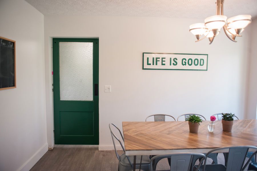 Life is Good with a green sliding barn door